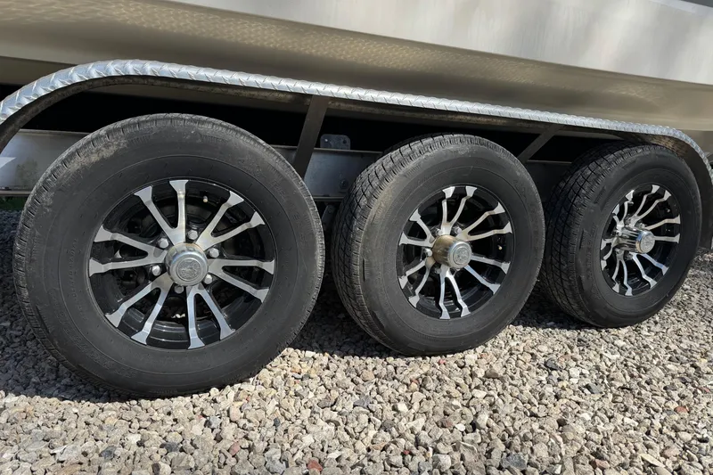 Slide: The Image of Triple axle trailer with stylish wheels for 2021 Monterey 295 Sport Yacht. - 26