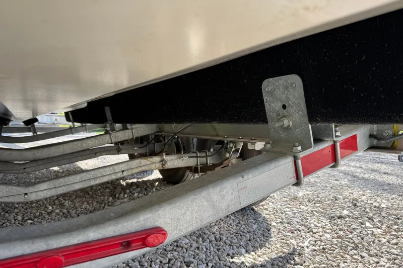 Slide: The Image of Underneath view of a 2021 Monterey 295 Sport Yacht on a trailer. - 28
