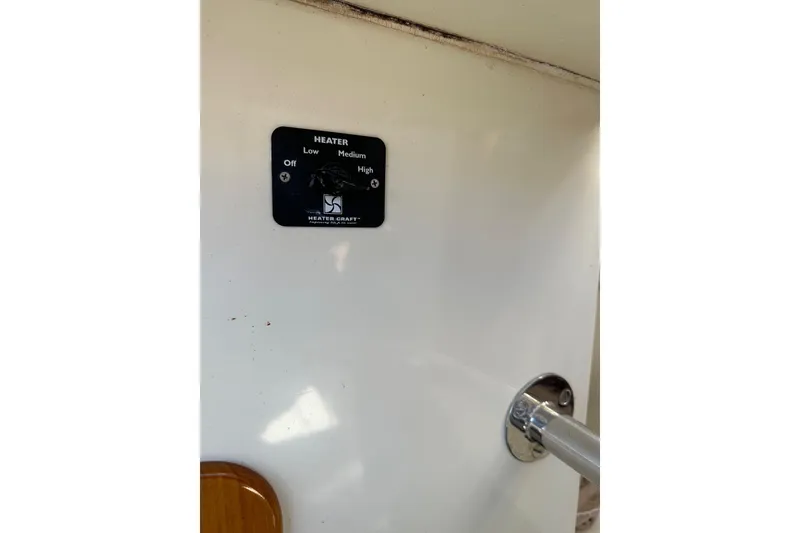 Slide: The Image of Heater control panel on 1996 Hinckley Picnic Boat 36 Classic interior. - 26