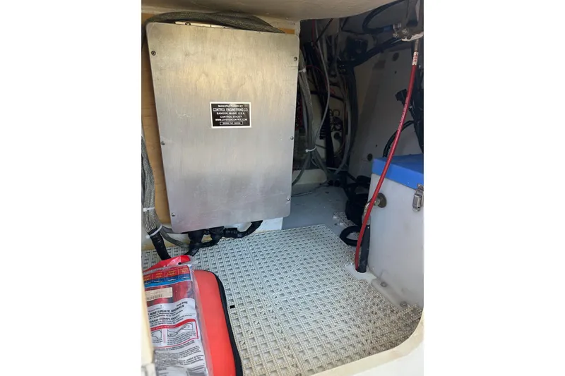Slide: The Image of Engine compartment of a 1996 Hinckley Picnic Boat 36 Classic, showing equipment and wiring. - 29