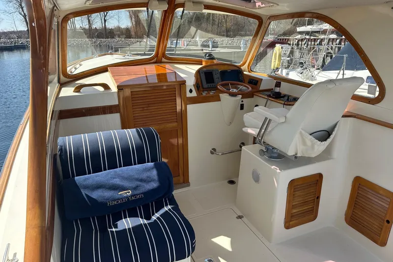 Slide: The Image of Interior of a 1996 Hinckley Picnic Boat 36 Classic with elegant wood and nautical design. - 8