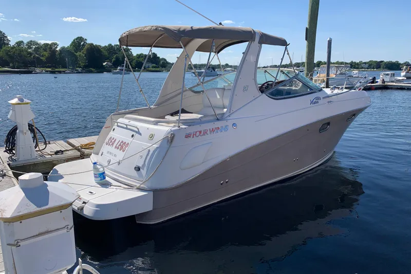 Slide: The Image of 2004 Four Winns 268 Vista boat docked at a marina on a sunny day. - 7