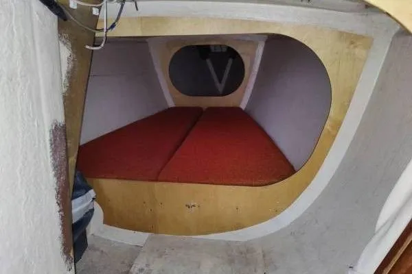Slide: The Image of Interior cabin of 1983 Cape Bay Fast 40 boat with red cushions. - 8