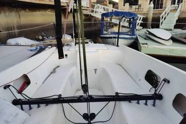 Slide: The Image of Cockpit view of a 1983 Cape Bay Fast 40 sailboat docked at a marina. - 9