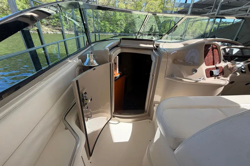 Slide: The Image of Interior view of a 2000 Sea Ray 410 Sundancer yacht cockpit with open cabin door. - 18
