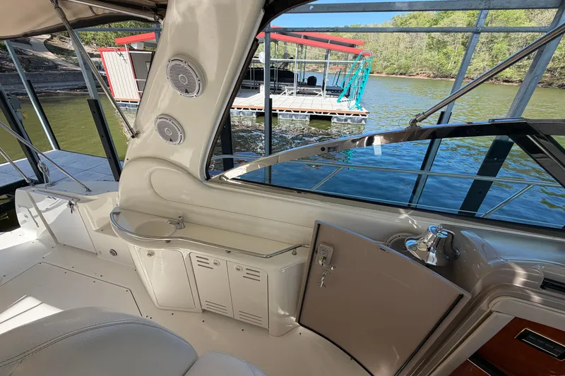 Slide: The Image of Interior view of a 2000 Sea Ray 410 Sundancer yacht docked by the water. - 26