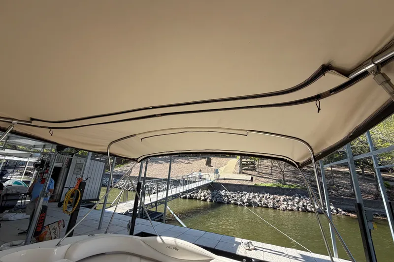 Slide: The Image of 2000 Sea Ray 410 Sundancer boat canopy with dockside view. - 29