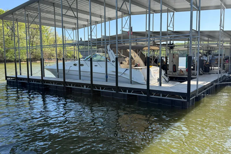 Slide: The Image of Docked 2000 Sea Ray 410 Sundancer under covered marina on a sunny day. - 3