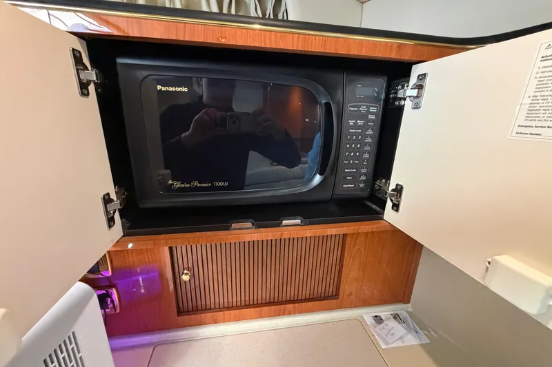 Slide: The Image of Panasonic microwave in 2000 Sea Ray 410 Sundancer yacht kitchen cabinet. - 34
