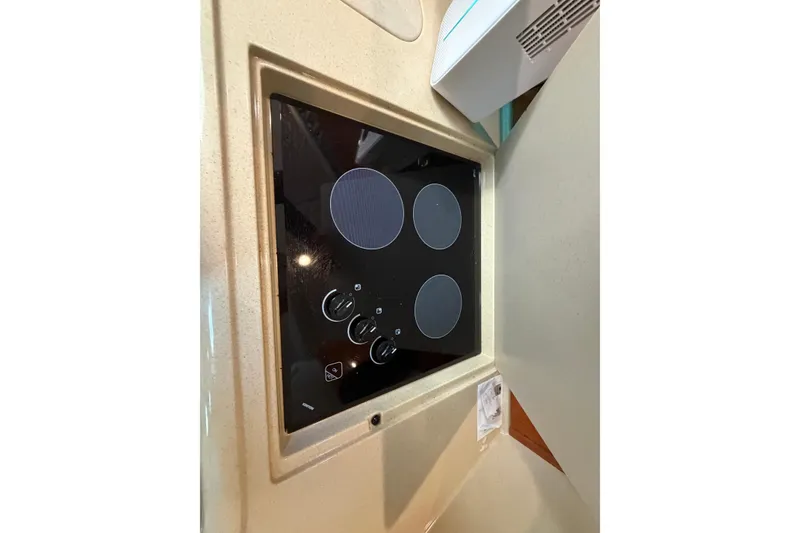 Slide: The Image of Stovetop in 2000 Sea Ray 410 Sundancer yacht kitchen area. - 35