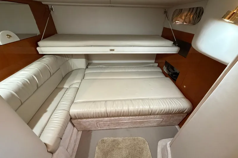 Slide: The Image of Interior cabin of 2000 Sea Ray 410 Sundancer with white leather seating. - 37