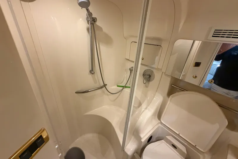 Slide: The Image of Bathroom interior of 2000 Sea Ray 410 Sundancer yacht, featuring shower and toilet. - 41