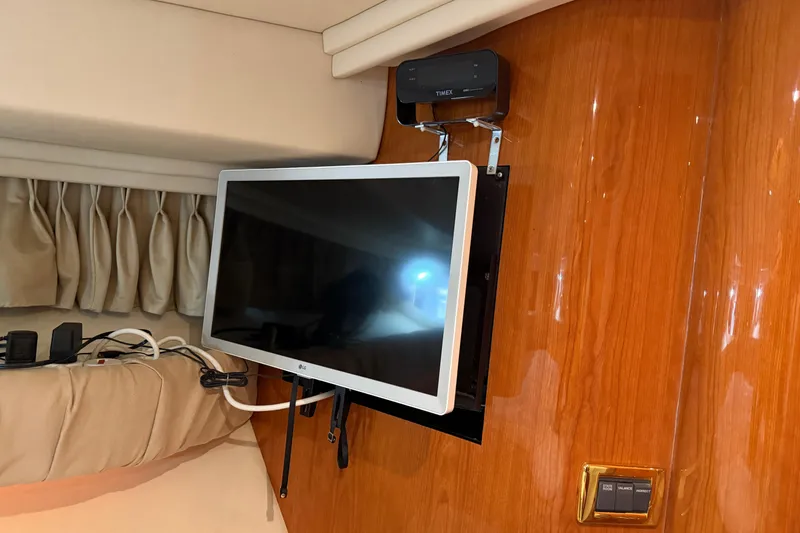 Slide: The Image of Flat-screen TV mounted in a 2000 Sea Ray 410 Sundancer yacht interior. - 44
