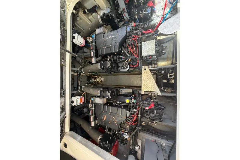 Slide: The Image of Engine compartment of a 2000 Sea Ray 410 Sundancer with visible wiring and components. - 46