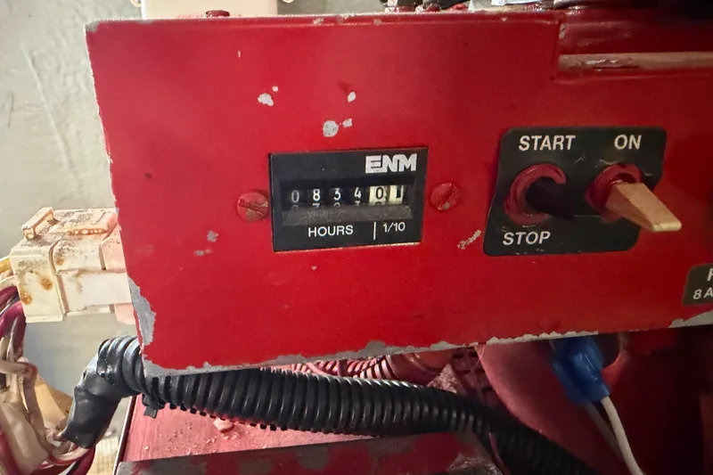 Slide: The Image of Hour meter and controls on a 2000 Sea Ray 410 Sundancer boat. - 53