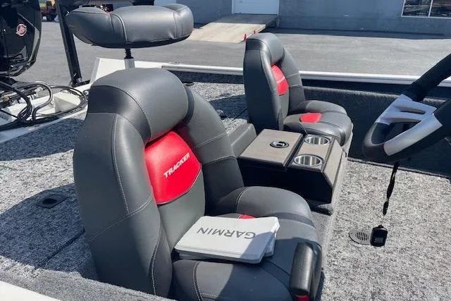 Slide: The Image of 2025 Tracker Pro Team 195 Tournament Edition boat interior with Garmin equipment and comfortable seating. - 11