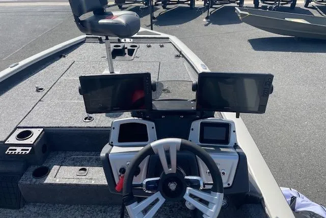 Slide: The Image of 2025 Tracker Pro Team 195 Tournament Edition boat dashboard with dual screens and steering wheel. - 14