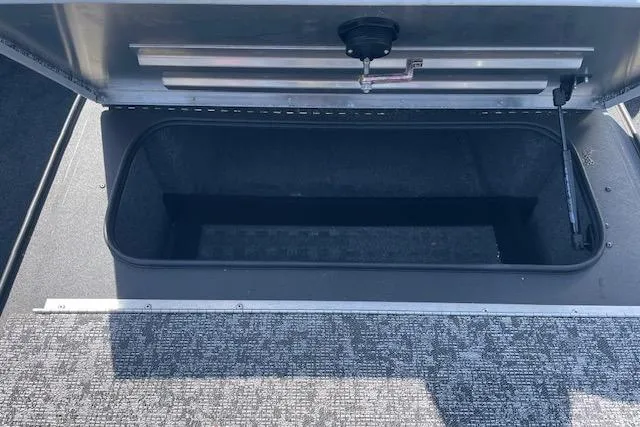 Slide: The Image of Open storage compartment in 2025 Tracker Pro Team 195 Tournament Edition boat. - 15