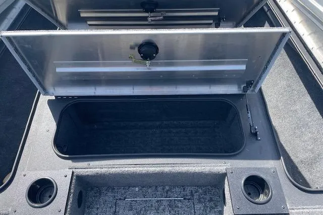 Slide: The Image of 2025 Tracker Pro Team 195 Tournament Edition boat storage compartment open, showing interior space. - 16