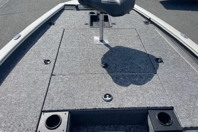 Slide: The Image of 2025 Tracker Pro Team 195 Tournament Edition boat deck with seating and storage compartments. - 18