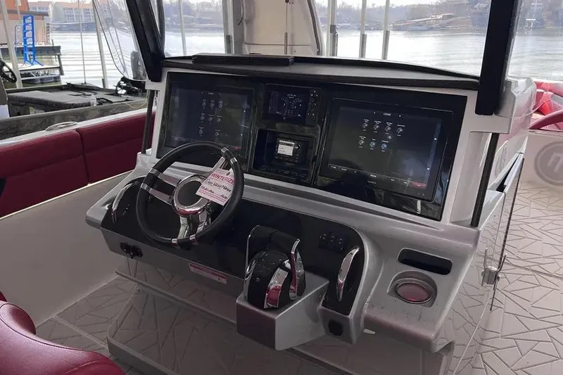 Slide: The Image of 2019 Mystic Powerboats M4200 helm with advanced navigation displays and controls. - 10