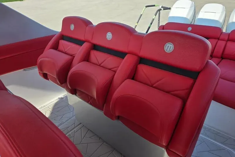 Slide: The Image of Red leather seats on 2019 Mystic Powerboats M4200, showcasing luxury and comfort. - 12