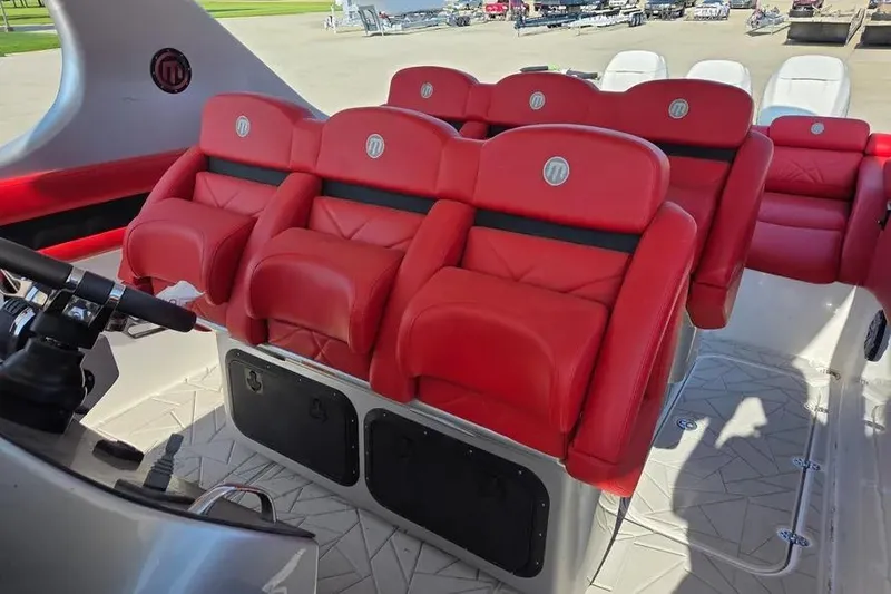Slide: The Image of 2019 Mystic Powerboats M4200 interior with red leather seats and modern design. - 14