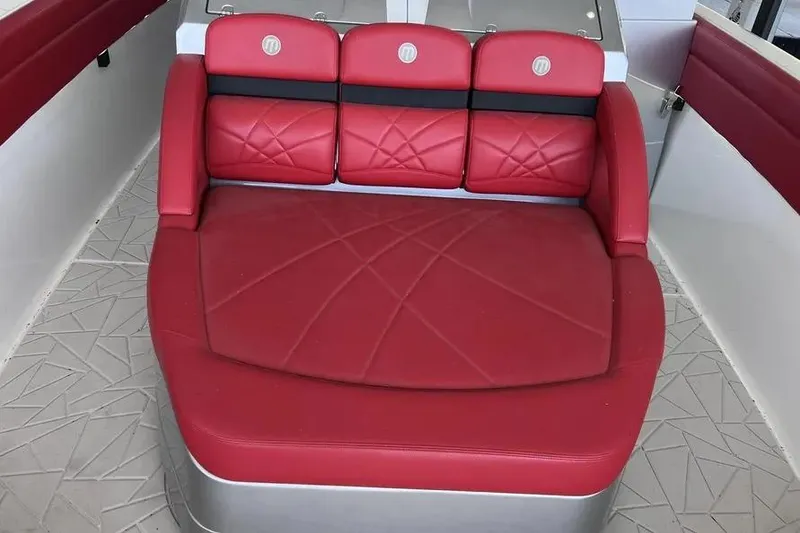 Slide: The Image of Red seating area on 2019 Mystic Powerboats M4200, featuring modern design and comfort. - 16