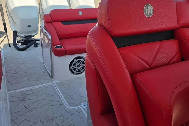 Slide: The Image of 2019 Mystic Powerboats M4200 interior with luxurious red seating and modern design elements. - 17