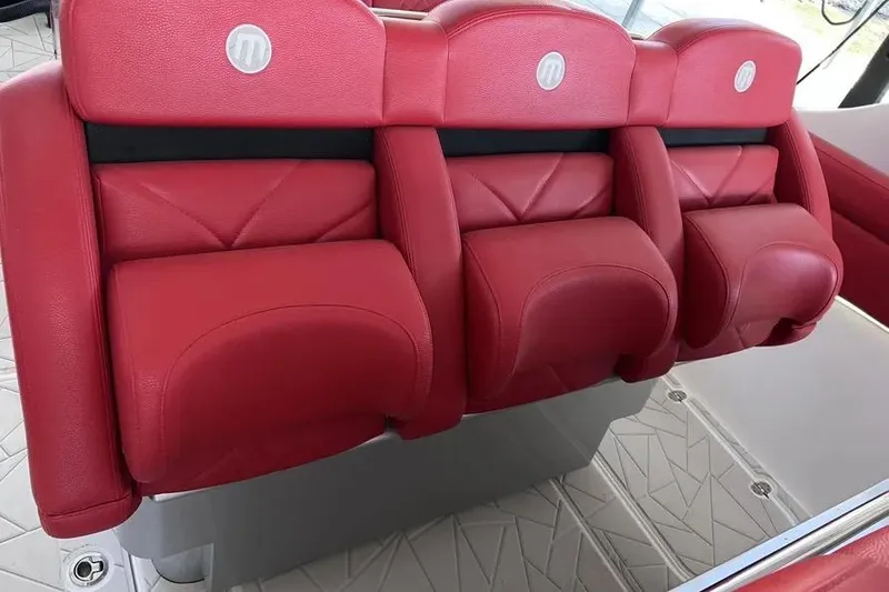 Slide: The Image of Red leather seats in a 2019 Mystic Powerboats M4200, showcasing luxury and comfort. - 18
