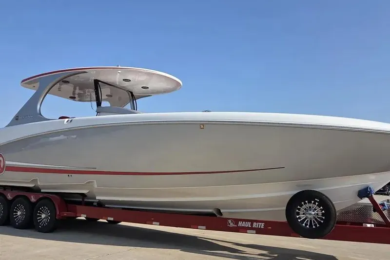 The Image of 2019 Mystic Powerboats M4200 on trailer under clear blue sky. - 2