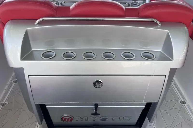 Slide: The Image of 2019 Mystic Powerboats M4200 interior with red seating and sleek silver console. - 21
