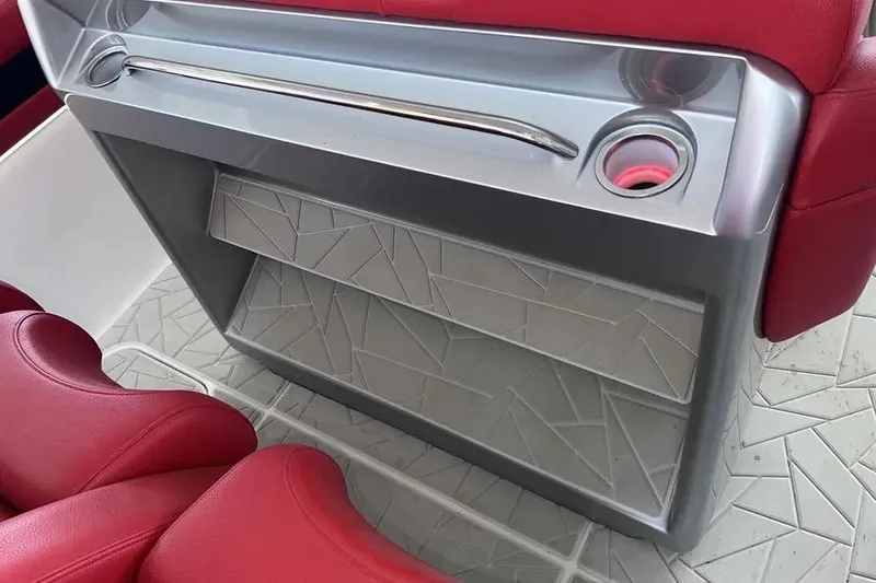 Slide: The Image of Interior of 2019 Mystic Powerboats M4200 with red seating and modern console design. - 23