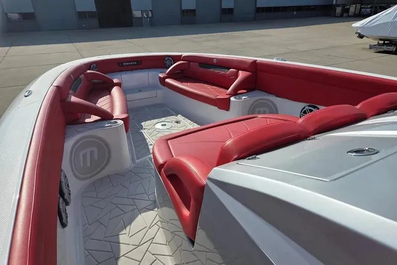 Slide: The Image of 2019 Mystic Powerboats M4200 interior with red seating and modern design. - 5