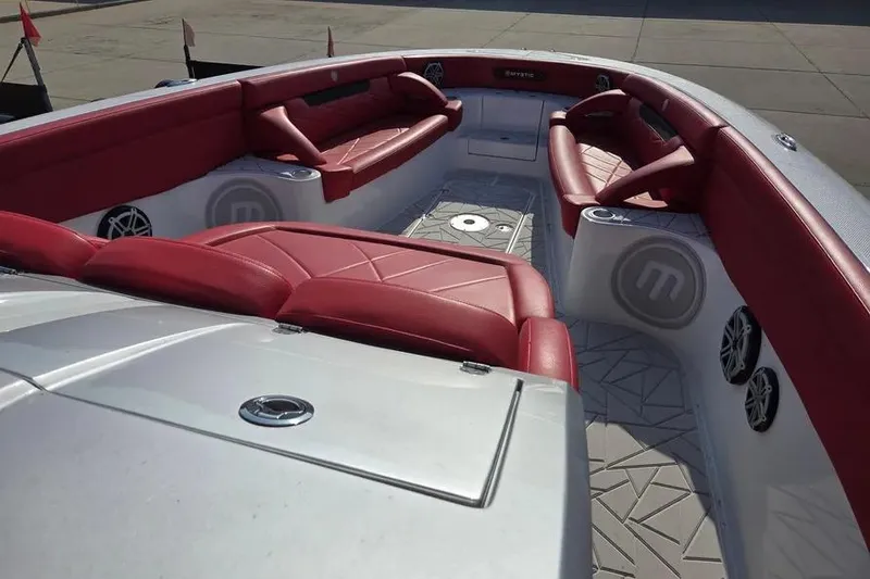 Slide: The Image of 2019 Mystic Powerboats M4200 interior with red seating and modern design. - 6