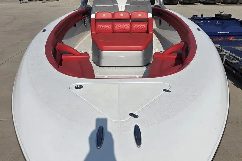 Slide: The Image of 2019 Mystic Powerboats M4200 with red seating, docked on concrete surface. - 8