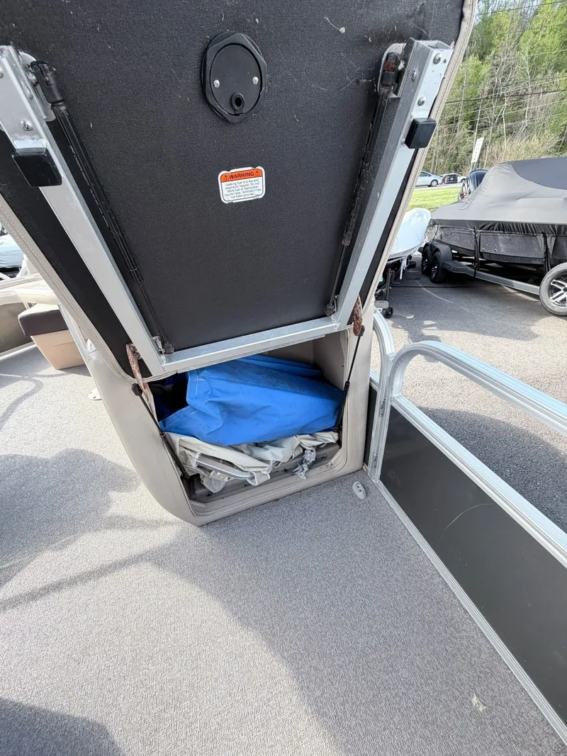 Slide: The Image of Storage compartment in Sun Tracker Party Barge 20 DLX boat, 2018 model. - 16