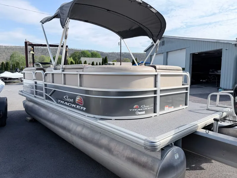 Slide: The Image of 2018 Sun Tracker Party Barge 20 DLX pontoon boat on parking lot. - 8