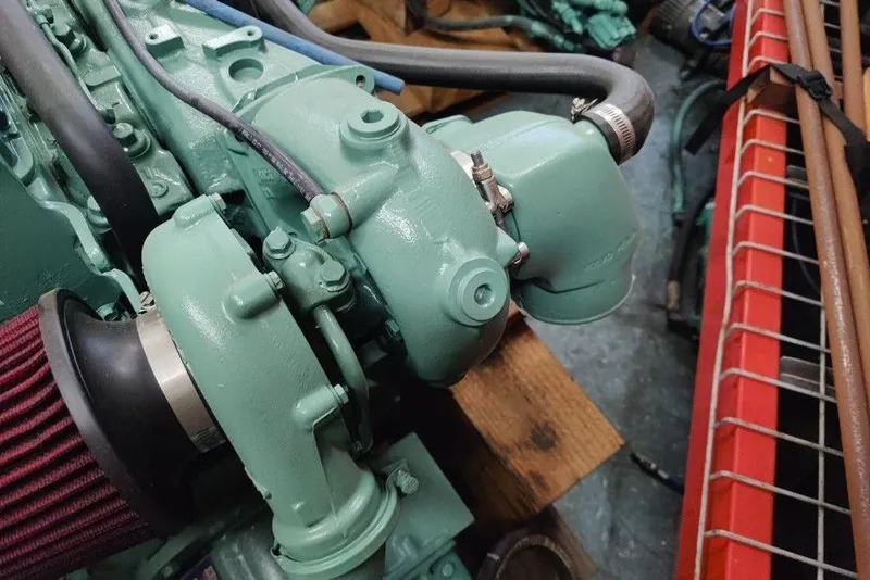 Slide: The Image of Close-up of a 1991 Mako 286 engine component with hoses and filter. - 11