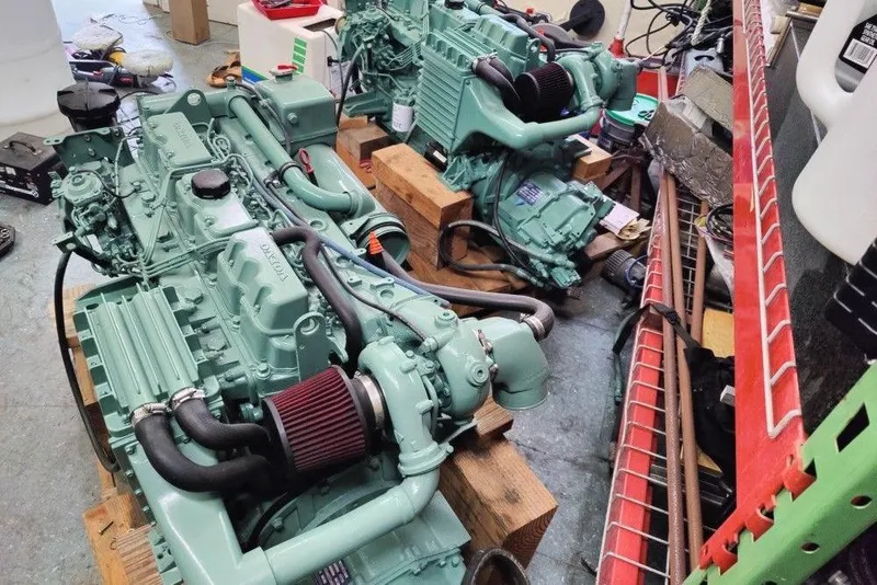 Slide: The Image of Two green Mako 286 engines from 1991 on wooden blocks in a workshop. - 12