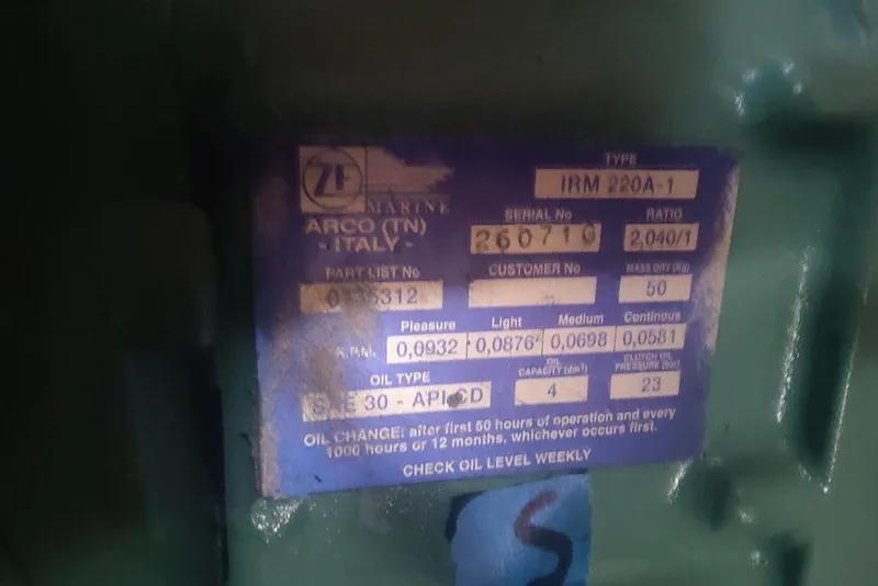 Slide: The Image of Label on machinery with specifications and oil change instructions, Mako 286, 1991 model. - 14