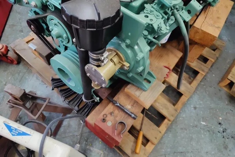 Slide: The Image of 1991 Mako 286 engine on wooden pallet in workshop setting. - 17