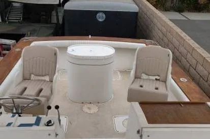 Slide: The Image of 1991 Mako 286 boat interior with seating and steering wheel. - 4