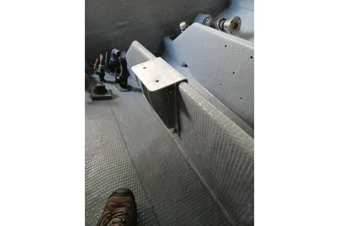Slide: The Image of Interior of a 1991 Mako 286 boat showing textured flooring and control mechanisms. - 8