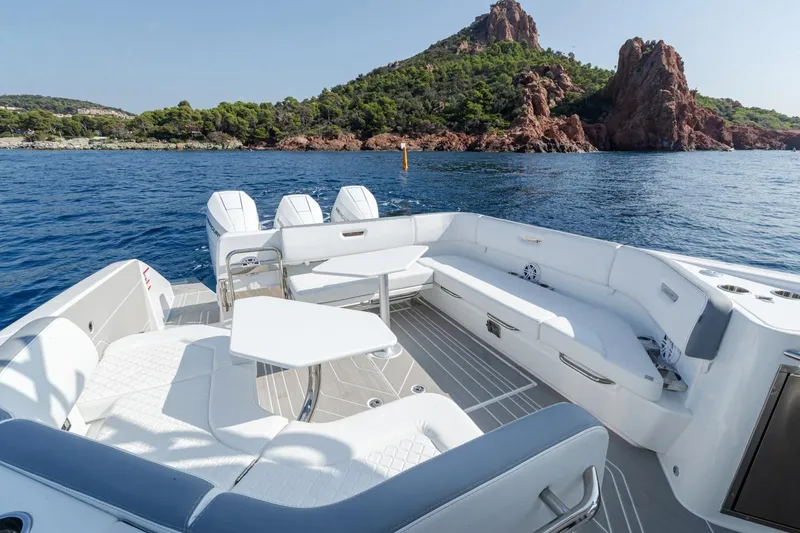 Slide: The Image of Manufacturer Provided Image: Luxurious 2026 Wellcraft 38 T-Top boat interior with scenic ocean and island backdrop. - 2