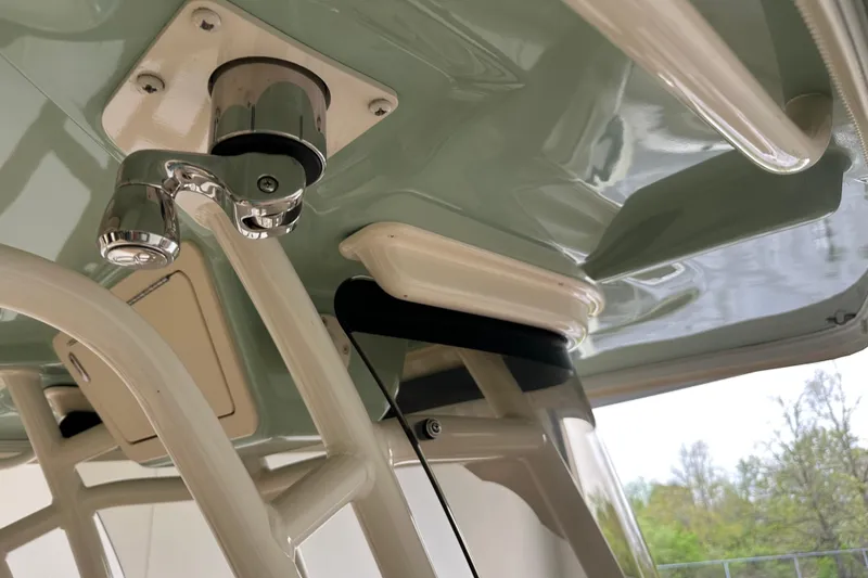 Slide: The Image of 2023 Grady-White Fisherman 236 boat detail, featuring a polished metal fixture. - 13