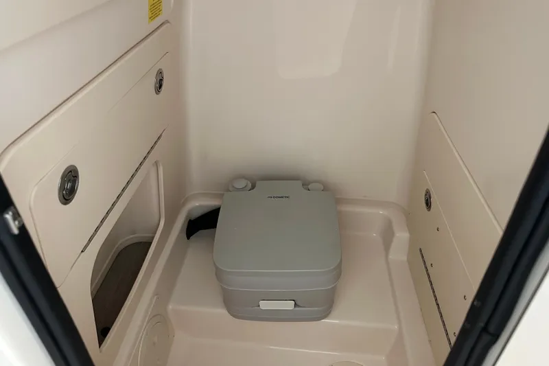 Slide: The Image of 2023 Grady-White Fisherman 236 boat interior with portable toilet. - 16