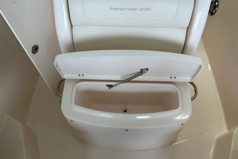 Slide: The Image of 2023 Grady-White Fisherman 236 boat seat with open storage compartment. - 17