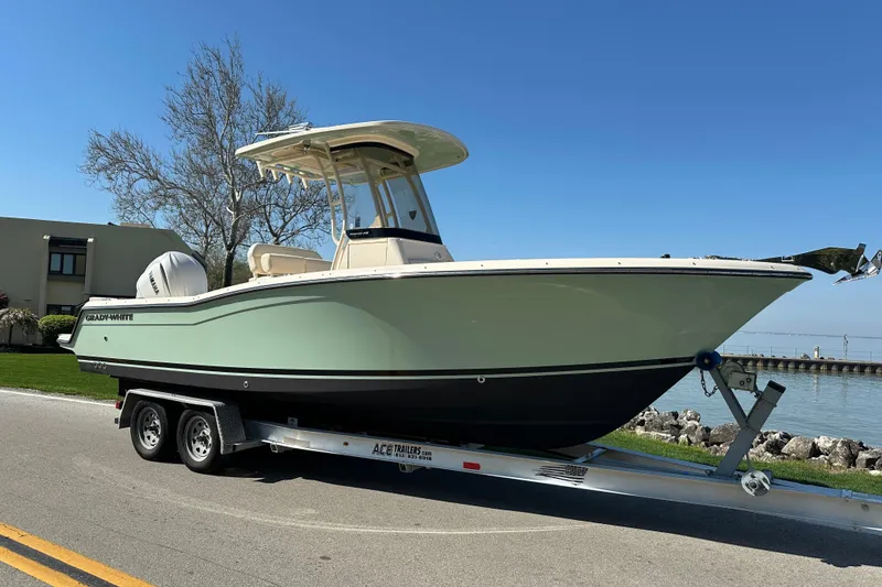 Slide: The Image of 2023 Grady-White Fisherman 236 boat on trailer by waterfront. - 2