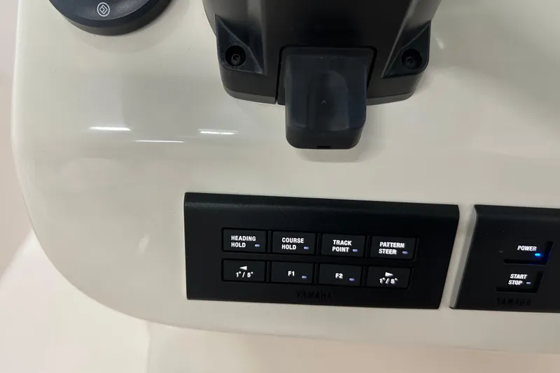 Slide: The Image of Control panel of 2023 Grady-White Fisherman 236 boat with navigation buttons. - 23